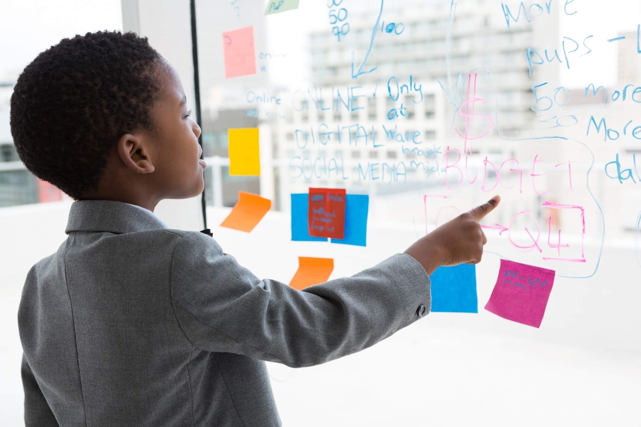 Boy learning using note cards and a chart