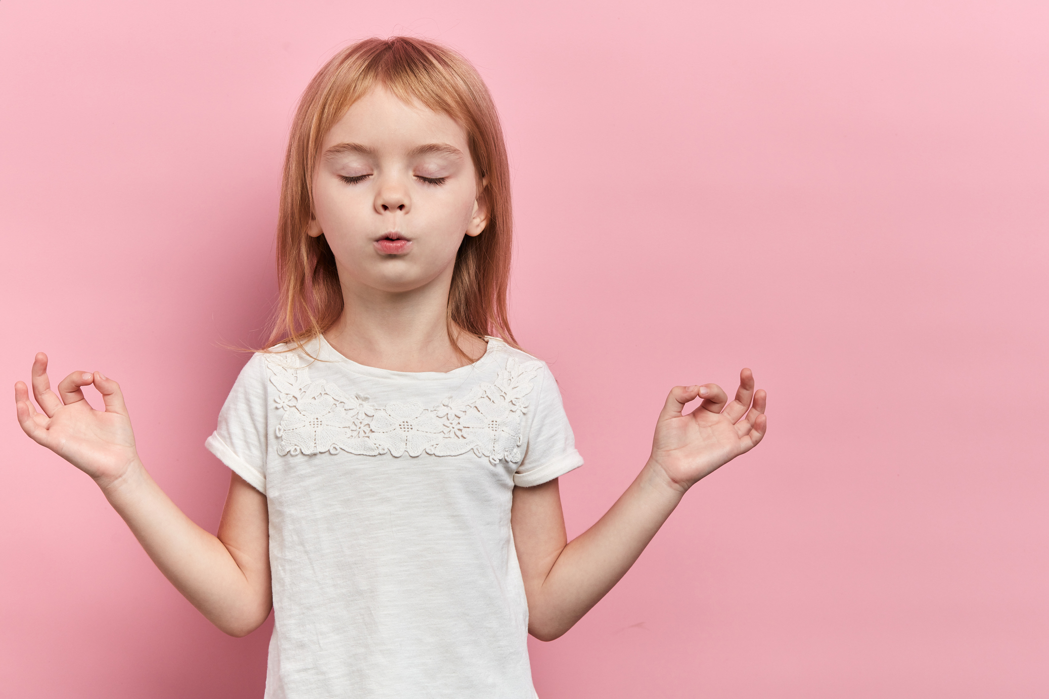 Little relaxed cute girl practicing yoga, isolated on pink | Studer ...