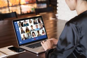 woman in video conference on laptop