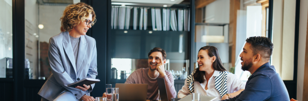 Group of colleagues planning strategically to increase alignment within systems.