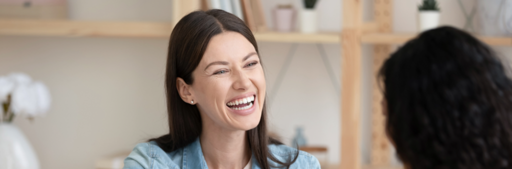 Woman smiling providing service excellence