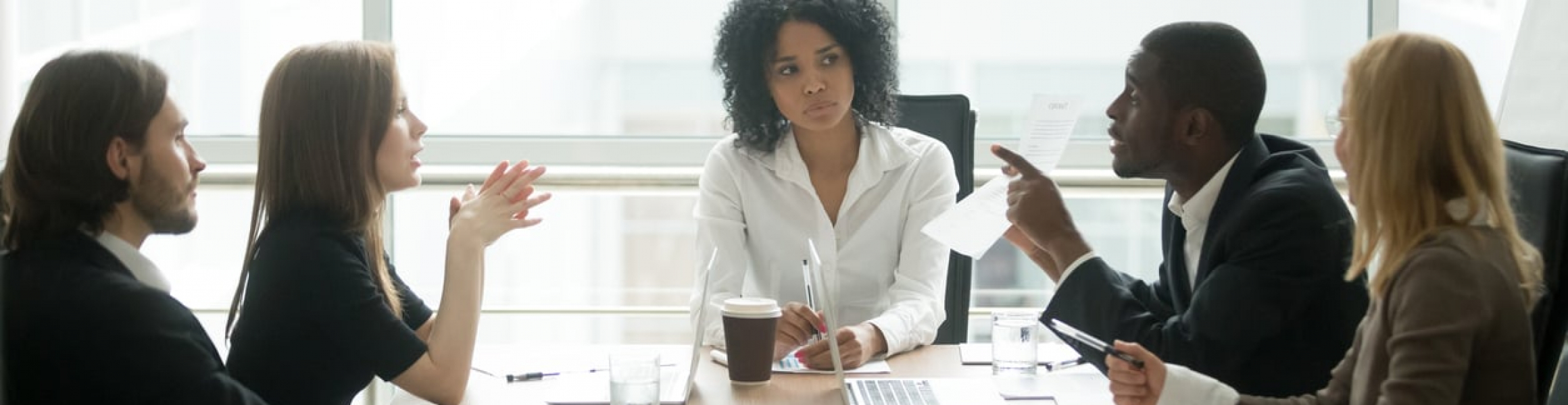 Multiracial people group having dispute about bad contract at meeting ...